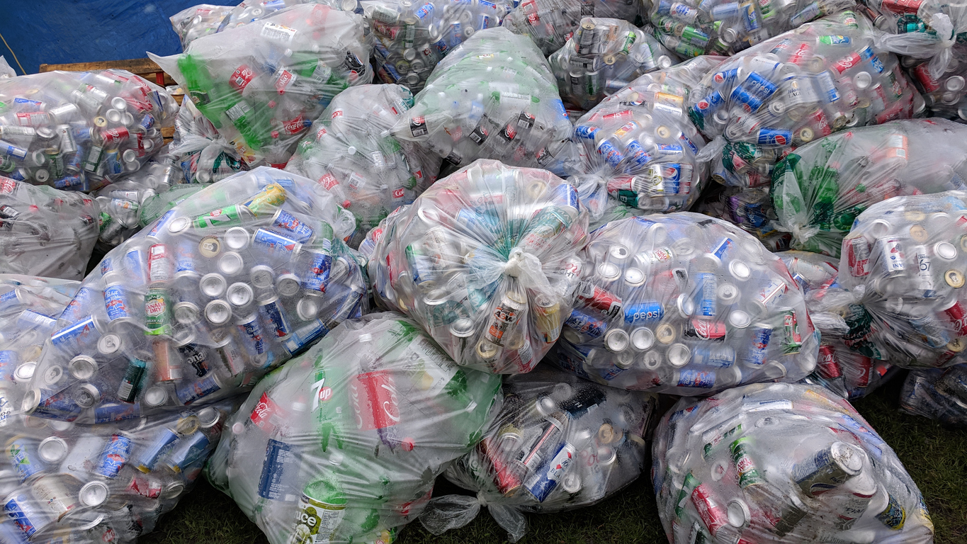 Lifestyle...This close up shot shows thousands of aluminum beverage cans, in transparent plastic bags, being collected for re-cycling.